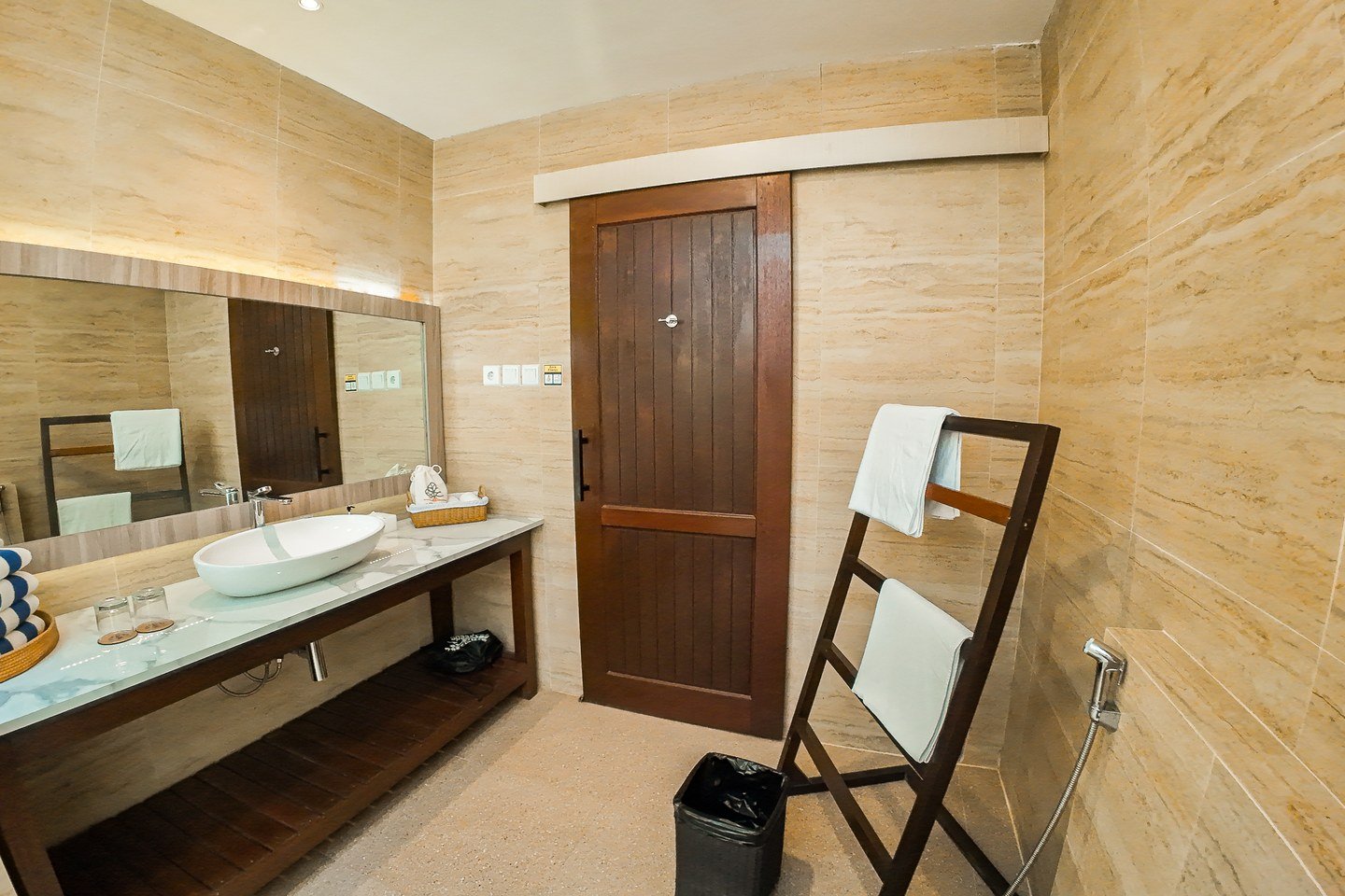 Open-air shower area shared by Arasatu's villa layouts.