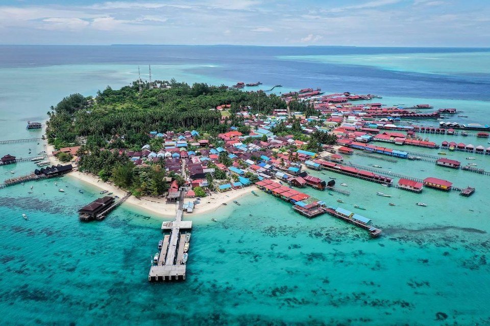 Aerial view of Derawan Island and its surrounding shallow water.