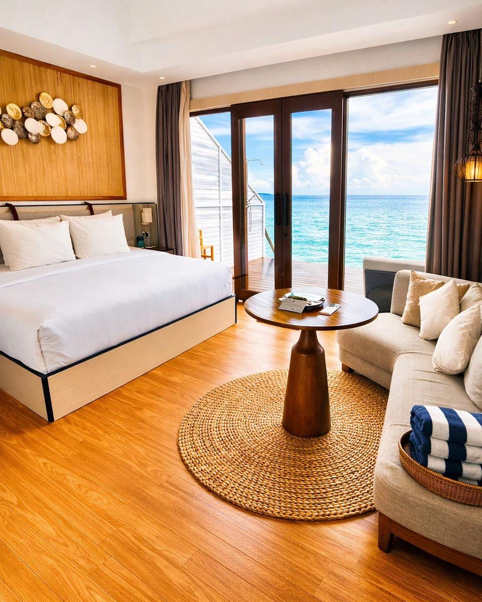 Arasatu villa bedroom with a king bed and a view toward the sea.