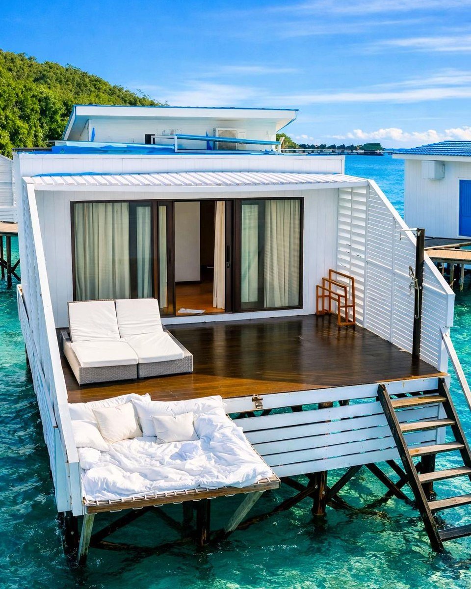 Private deck of an Arasatu Floating Villa above the sea.