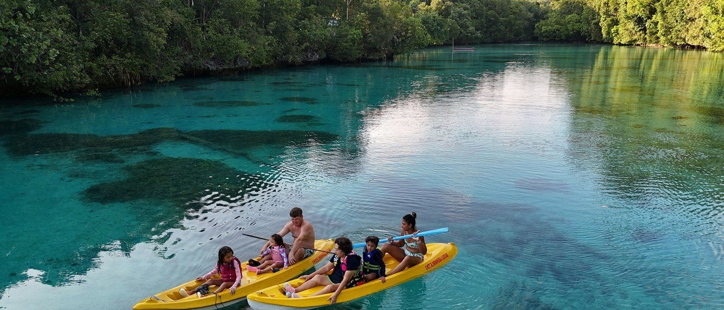 Kehe Daing Lagoon surrounded by forest on a journey from Arasatu.