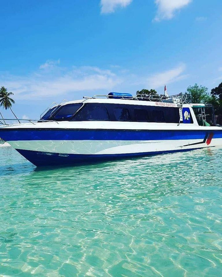 A speedboat in shallow water near the Maratua islands.