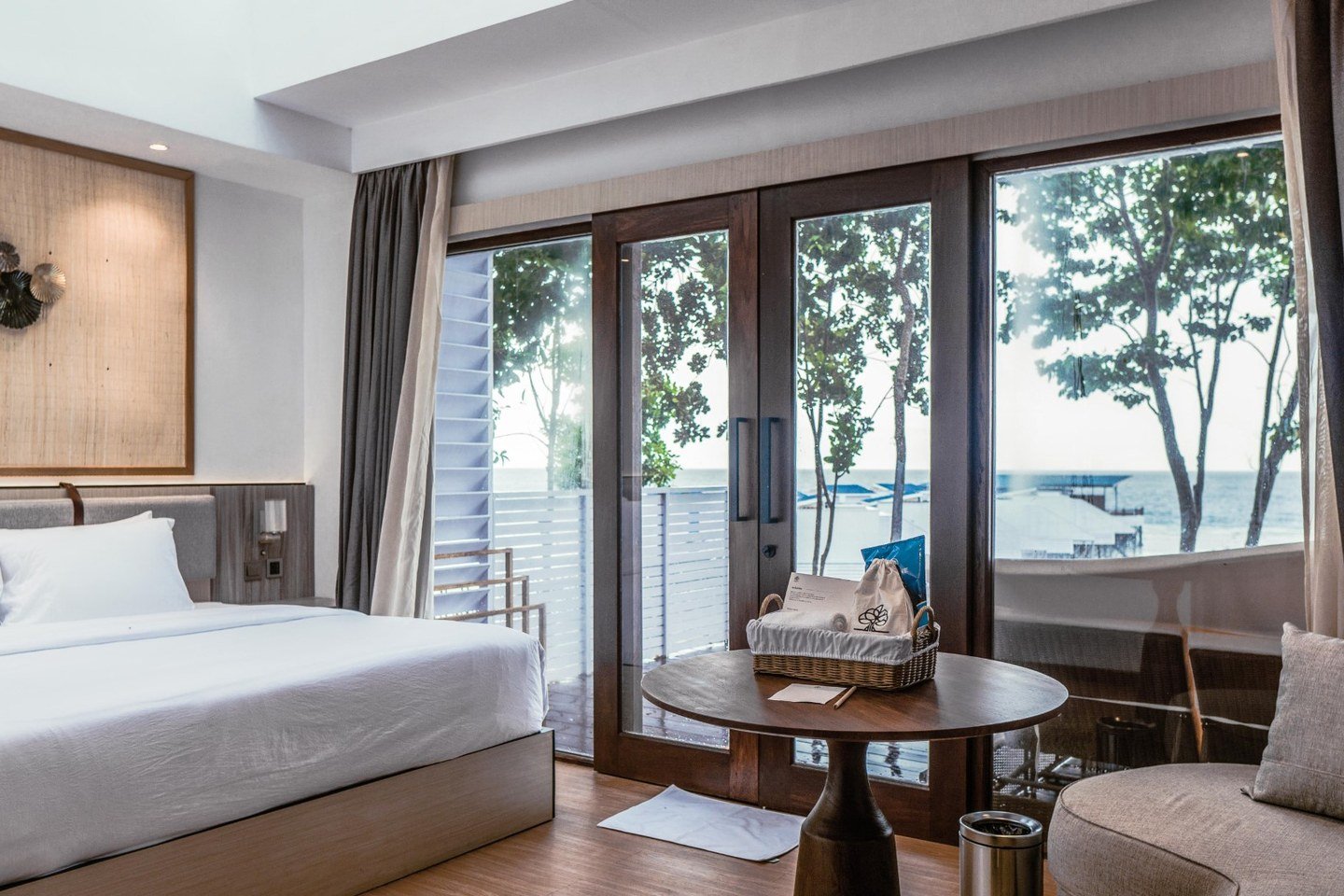 Sea View Villa bedroom looking across the resort and water from the cliff.