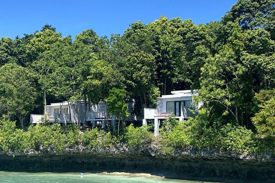 Exterior of an Arasatu Sea View Villa above the resort's overwater setting.